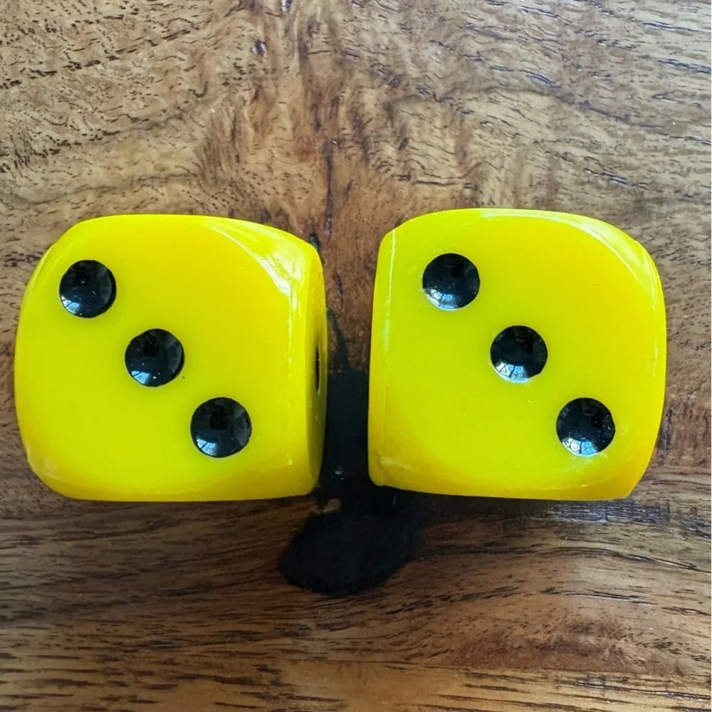 Vintage pair of yellow and black large dice